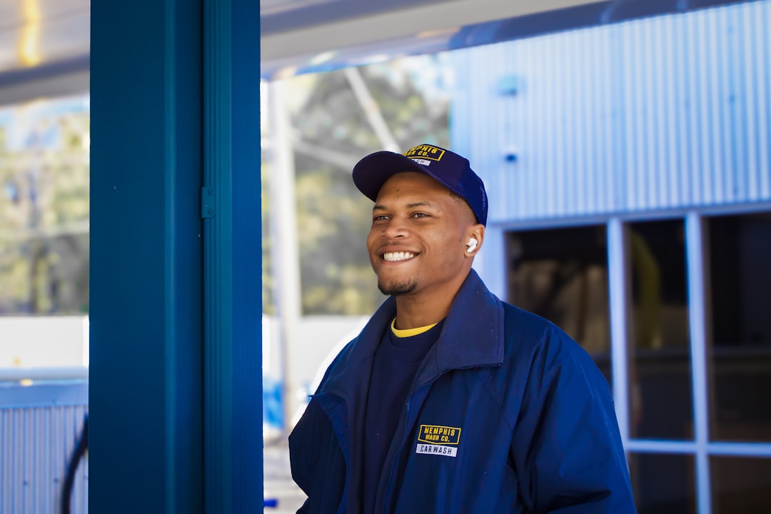 Technician in uniform, approachable owner-operator portrait