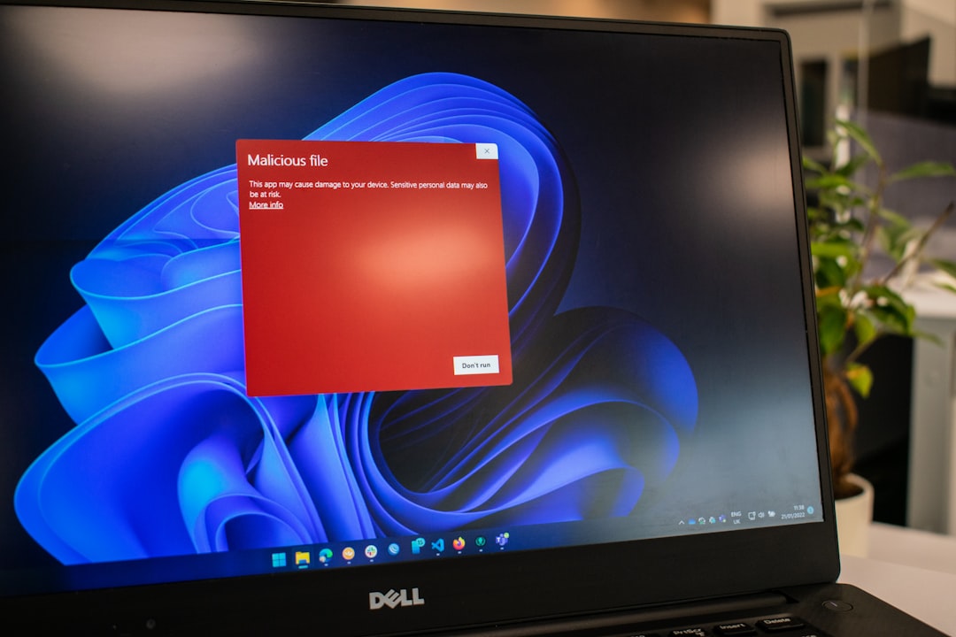 Laptop screen showing a security alert during a virus removal diagnostic